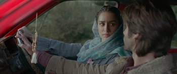 Movie still from “Haider” (2014), directed by Vishal Bhardwaj – A woman sitting in the passenger seat of a car; Close Up shot, Over the shoulder angle