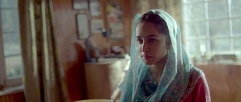 Movie still from “Haider” (2014), directed by Vishal Bhardwaj – A young woman with a blue veil on her head; Close Up shot, Over the shoulder angle