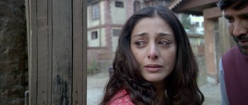 Movie still from “Haider” (2014), directed by Vishal Bhardwaj – A person looking out of a window; Close Up shot, Low angle