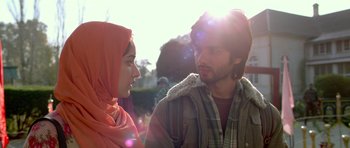 Movie still from “Haider” (2014), directed by Vishal Bhardwaj – A man and a woman are talking in the sunlight; Close Up shot, Over the shoulder angle
