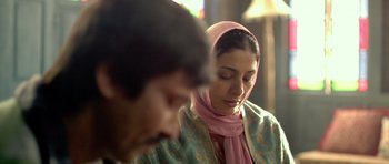 Movie still from “Haider” (2014), directed by Vishal Bhardwaj – A man and a woman wearing a head scarf; Close Up shot, Over the shoulder angle