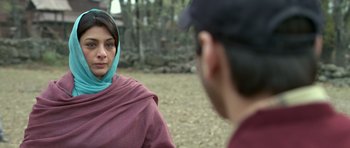 Movie still from “Haider” (2014), directed by Vishal Bhardwaj – A woman wearing a headscarf is talking to a man; Close Up shot, Over the shoulder angle