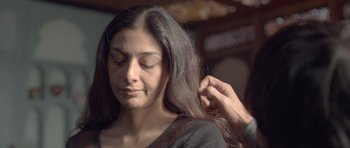 Movie still from “Haider” (2014), directed by Vishal Bhardwaj – A woman getting her hair dried by a stylist; Close Up shot, Over the shoulder angle