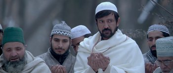 Movie still from “Haider” (2014), directed by Vishal Bhardwaj – A group of men standing next to each other; Close Up shot, Low angle