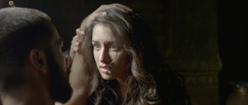 Movie still from “Haider” (2014), directed by Vishal Bhardwaj – A beautiful young woman with long , brown hair; Close Up shot, Overhead angle