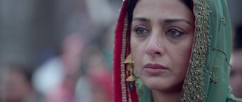 Movie still from “Haider” (2014), directed by Vishal Bhardwaj – A person wearing a head dress; Close Up shot, High angle
