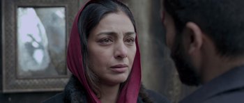 Movie still from “Haider” (2014), directed by Vishal Bhardwaj – A person wearing a headscarf; Close Up shot, Over the shoulder angle