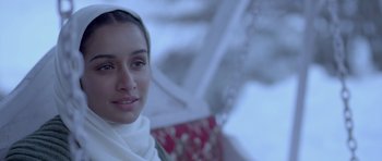 Movie still from “Haider” (2014), directed by Vishal Bhardwaj – A person wearing a headscarf; Close Up shot, Over the shoulder angle