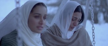 Movie still from “Haider” (2014), directed by Vishal Bhardwaj – Two young women dressed in religious clothing; Close Up shot, Low angle