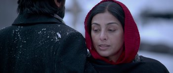 Movie still from “Haider” (2014), directed by Vishal Bhardwaj – A person wearing a hood; Close Up shot, Over the shoulder angle