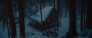 Movie still from “Hanna” (2011), directed by Joe Wright – A cabin in the middle of the woods in the snow; Extreme Wide shot, High angle