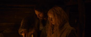 Movie still from “Hanna” (2011), directed by Joe Wright – A man and a woman standing next to each other; Medium shot, Low angle