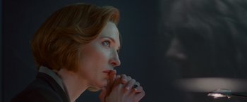 Movie still from “Hanna” (2011), directed by Joe Wright – A person holding their hands to their face; Close Up shot, Low angle