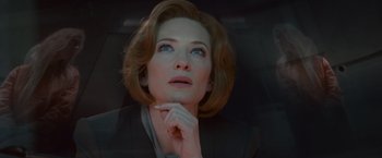 Movie still from “Hanna” (2011), directed by Joe Wright – A person wearing a suit; Close Up shot, Low angle