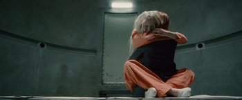 Movie still from “Hanna” (2011), directed by Joe Wright – A woman is hugging another woman in an industrial setting; Wide shot, Overhead angle