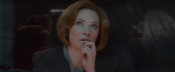 Movie still from “Hanna” (2011), directed by Joe Wright – A person sitting in a car with her hand under her chin; Close Up shot, Low angle