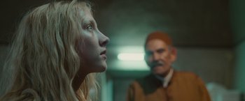 Movie still from “Hanna” (2011), directed by Joe Wright – A man and a woman looking at each other in a room; Close Up shot, Over the shoulder angle