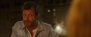 Movie still from “Hanna” (2011), directed by Joe Wright – A person wearing a jacket; Close Up shot, Over the shoulder angle
