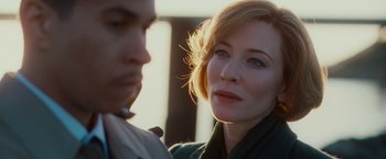 Movie still from “Hanna” (2011), directed by Joe Wright – A woman and a man are looking at each other; Close Up shot, Over the shoulder angle