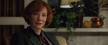 Movie still from “Hanna” (2011), directed by Joe Wright – A person sitting on a chair; Close Up shot, Over the shoulder angle