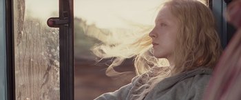 Movie still from “Hanna” (2011), directed by Joe Wright – A woman with long blonde hair blowing in the wind; Close Up shot, Low angle