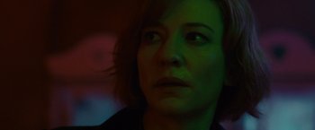 Movie still from “Hanna” (2011), directed by Joe Wright – A woman's face in green light; Close Up shot, Low angle