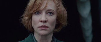 Movie still from “Hanna” (2011), directed by Joe Wright – A person with short red hair; Close Up shot, Low angle