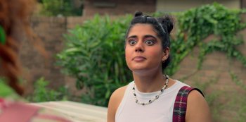 Movie still from “Heartbreak High” (2022), created by Michael Jenkins – A woman with her eyes wide open stares into the distance; Close Up shot, Over the shoulder angle