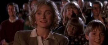 Movie still from “Hook” (1991), directed by Steven Spielberg – A person wearing a suit; Close Up shot, Over the shoulder angle