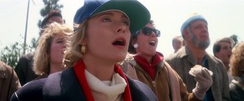 Movie still from “Hook” (1991), directed by Steven Spielberg – Two women are standing together and one is wearing a hat; Close Up shot, Low angle