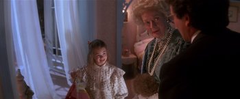 Movie still from “Hook” (1991), directed by Steven Spielberg – An older woman and a little girl in a room; Medium shot, Over the shoulder angle