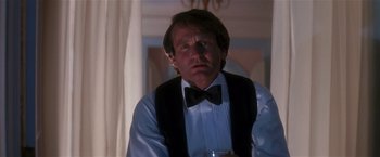 Movie still from “Hook” (1991), directed by Steven Spielberg – A person wearing a bow tie; Close Up shot, Low angle