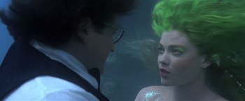 Movie still from “Hook” (1991), directed by Steven Spielberg – A man and a woman in a body of water; Close Up shot, Over the shoulder angle