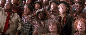 Movie still from “Hook” (1991), directed by Steven Spielberg – A group of young people standing in a crowd; Close Up shot, Low angle