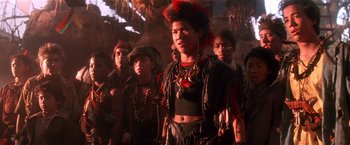 Movie still from “Hook” (1991), directed by Steven Spielberg – A group of young men standing next to each other; Medium shot, Low angle