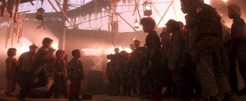 Movie still from “Hook” (1991), directed by Steven Spielberg – A group of children standing around a building; Wide shot, Low angle