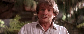 Movie still from “Hook” (1991), directed by Steven Spielberg – A person wearing a white shirt; Close Up shot, Over the shoulder angle