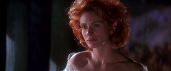 Movie still from “Hook” (1991), directed by Steven Spielberg – A person with curly red hair; Close Up shot, Low angle