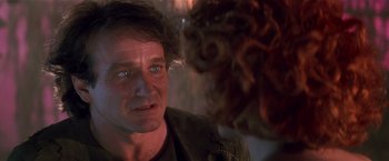 Movie still from “Hook” (1991), directed by Steven Spielberg – A man's face as he stares at a monster; Close Up shot, Over the shoulder angle