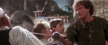 Movie still from “Hook” (1991), directed by Steven Spielberg – Two young children are playing with a sword; Close Up shot, Over the shoulder angle