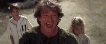 Movie still from “Hook” (1991), directed by Steven Spielberg – A person with long hair; Close Up shot, Low angle