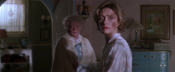 Movie still from “Hook” (1991), directed by Steven Spielberg – Two older women standing next to each other in a room; Medium shot, Low angle