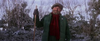 Movie still from “Hook” (1991), directed by Steven Spielberg – An older man holding a stick in the snow; Medium shot, Low angle