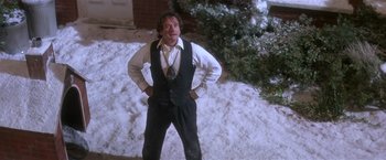 Movie still from “Hook” (1991), directed by Steven Spielberg – A man standing in front of a snow covered tree; Medium shot, Low angle