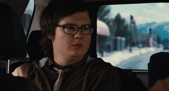 Movie still from “Hot Tub Time Machine” (2010), directed by Steve Pink – A man with glasses sitting in the back of a car; Close Up shot, Over the shoulder angle