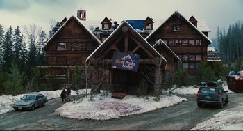Movie still from “Hot Tub Time Machine” (2010), directed by Steve Pink – Two people are walking in front of a lodge in the snow; Extreme Wide shot, High angle
