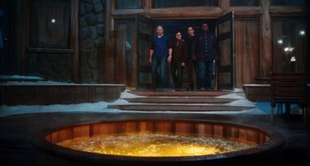 Movie still from “Hot Tub Time Machine” (2010), directed by Steve Pink – A group of people standing in front of a large hot tub; Wide shot, High angle