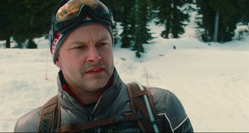 Movie still from “Hot Tub Time Machine” (2010), directed by Steve Pink – A person wearing a helmet on a ski slope; Close Up shot, Over the shoulder angle