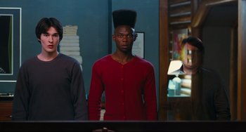 Movie still from “Hot Tub Time Machine” (2010), directed by Steve Pink – A man standing next to another man in front of a mirror; Medium shot, Over the shoulder angle