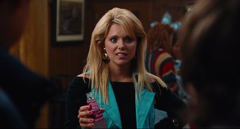 Movie still from “Hot Tub Time Machine” (2010), directed by Steve Pink – A woman holding a soda bottle in her hand; Close Up shot, Over the shoulder angle